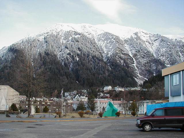 Wide view of mountains behind downtown, with Governor's Mansion.