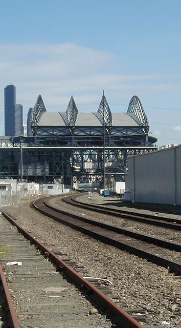 Retracted roof and railroad tracks.