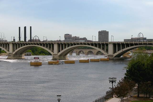 Looking downriver from the Hennepin Avenue Bridge. The Stone Arch Bridge can be seen through one of the arches of the 3rd Avenue Bridge