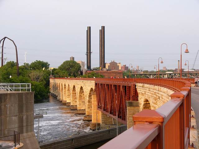 The upriver face of the Stone Arch Bridge at sunset