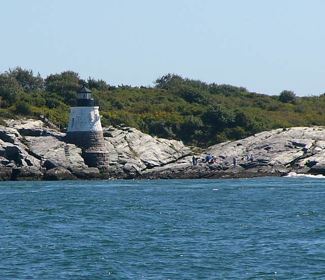 Castle Hill Lighthouse (I think) near the mouth of Narragansett Bay, with some picnickers on the rocks.