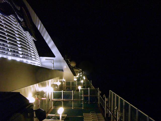 Looking forward at night on the starboard side.