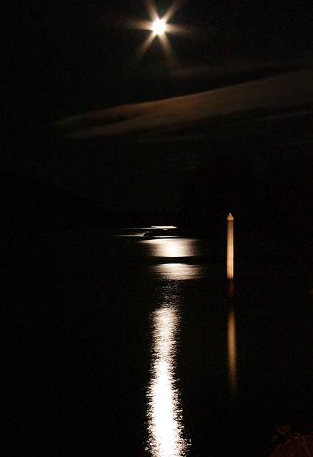 Later that night... the moon's glow reflects off the surface of Sitka Sound.