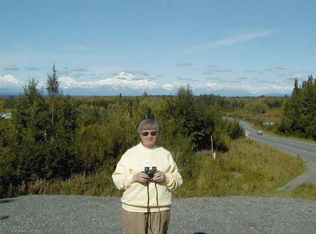 Mom outside of Talkeetna, with Denali in the background